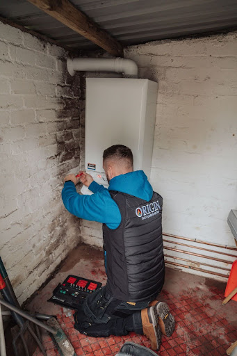 ORIGINS-HEATING-ENGINEER-WORKING-ON-BOILER