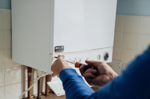 ready to upgrade?, heating engineer fixing boiler at origin
