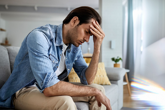 Man looking stressed about his old boiler